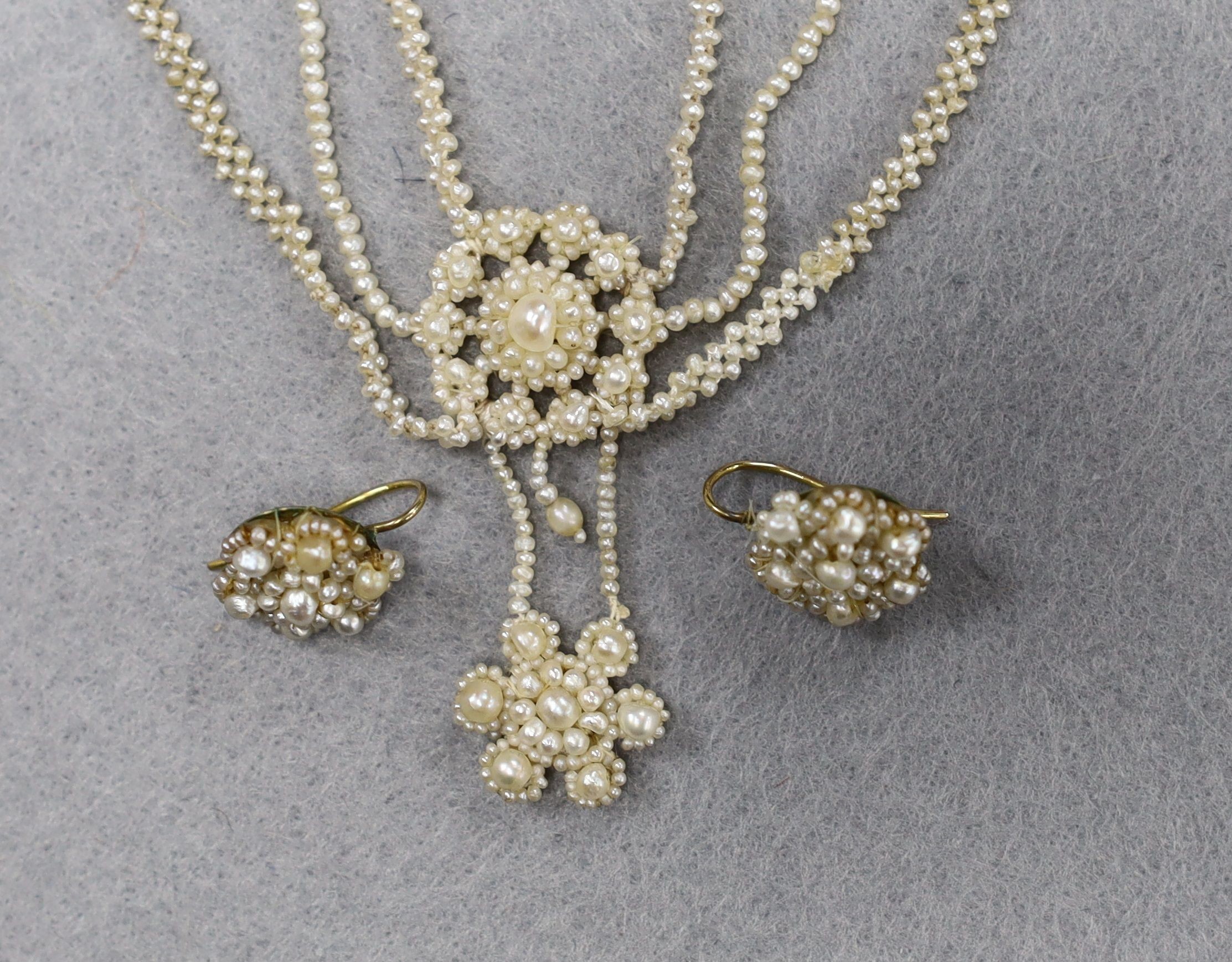 A 19th century multi strand seed pearl necklace, 40cm and a pair of similar earrings.